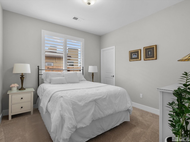 bedroom featuring carpet and baseboards