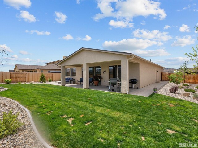 back of property featuring stucco siding, a patio area, and an outdoor hangout area