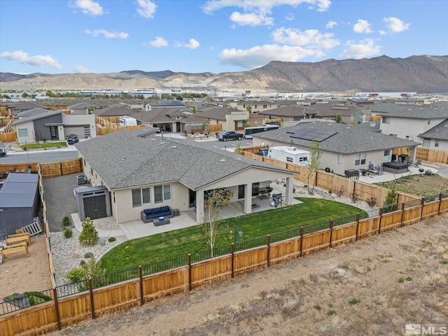 aerial view of residential area with mountains