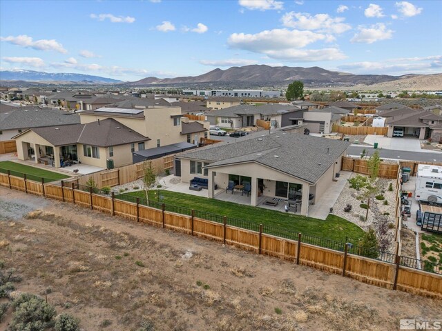 aerial perspective of suburban area with mountains