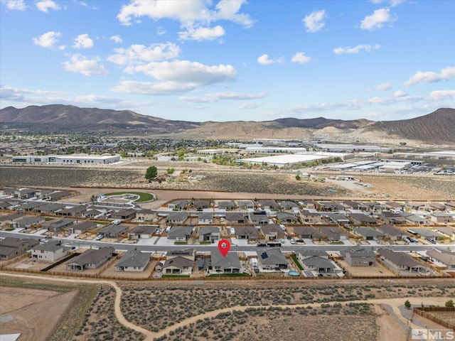 aerial view of residential area featuring a mountain backdrop