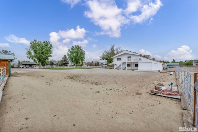 1131 Linda Anne Ct, Gardnerville, NV 89410 - view of yard with fence, stairs, and a garage