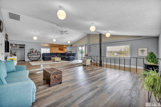 1131 Linda Anne Ct, Gardnerville, NV 89410 - living area with lofted ceiling, wood finished floors, a textured ceiling, ceiling fan, and baseboards