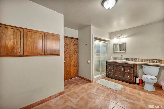 1131 Linda Anne Ct, Gardnerville, NV 89410 - full bath featuring a stall shower, tile patterned floors, vanity, toilet, and baseboards