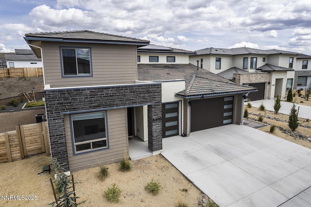 5410 Cactus Quartz Ct, Sparks, NV 89436 - view of front of property featuring a garage, driveway, and stone siding