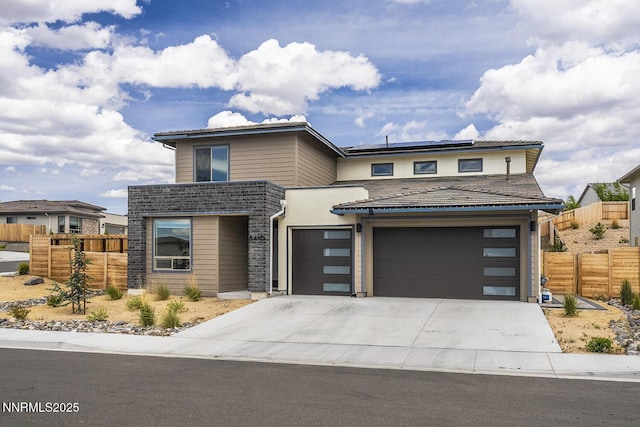 5410 Cactus Quartz Ct, Sparks, NV 89436 - contemporary home featuring roof mounted solar panels, concrete driveway, and an attached garage