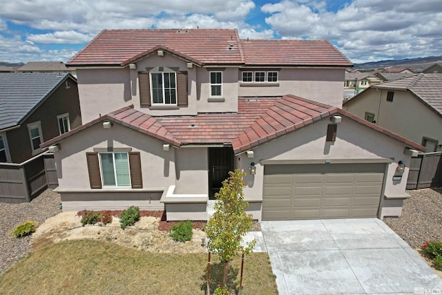 2091 Forest Grove Ln, Sparks, NV 89436 - view of front of house featuring stucco siding, a tiled roof, driveway, and an attached garage