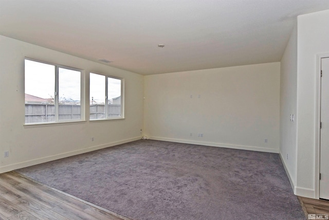 2091 Forest Grove Ln, Sparks, NV 89436 - carpeted empty room featuring baseboards and wood finished floors