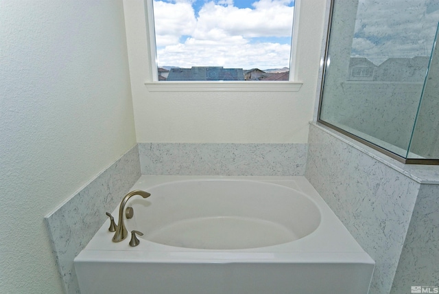 2091 Forest Grove Ln, Sparks, NV 89436 - bathroom featuring a bath and a textured wall