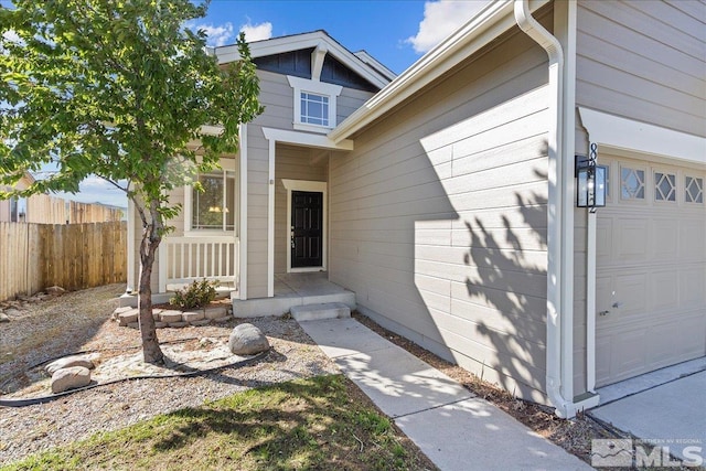 8952 Mahon Dr, Reno, NV 89506 - entrance to property featuring fence and a garage