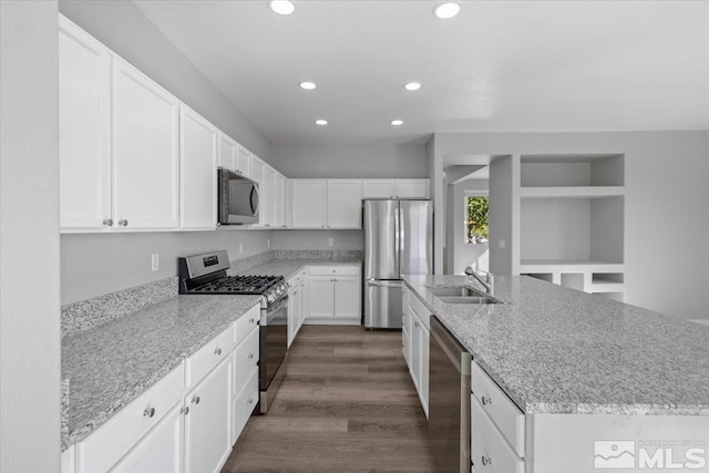8952 Mahon Dr, Reno, NV 89506 - kitchen featuring appliances with stainless steel finishes, a sink, recessed lighting, a kitchen island with sink, and white cabinets