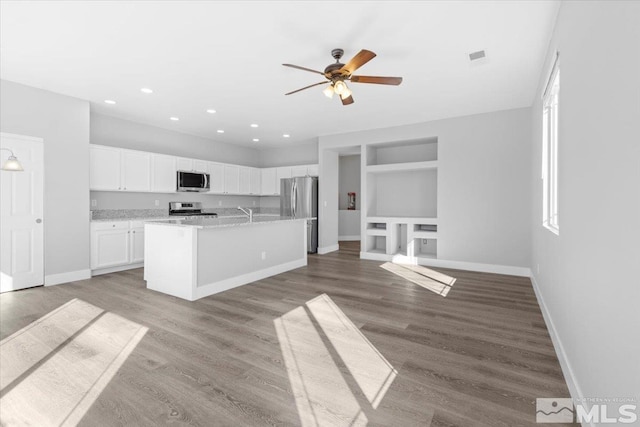 8952 Mahon Dr, Reno, NV 89506 - kitchen featuring stainless steel appliances, a ceiling fan, white cabinetry, baseboards, and recessed lighting