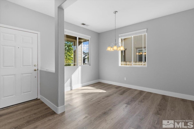 8952 Mahon Dr, Reno, NV 89506 - foyer featuring wood finished floors, baseboards, and a chandelier