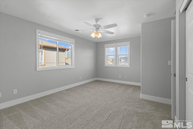 8952 Mahon Dr, Reno, NV 89506 - spare room with carpet, a ceiling fan, and baseboards