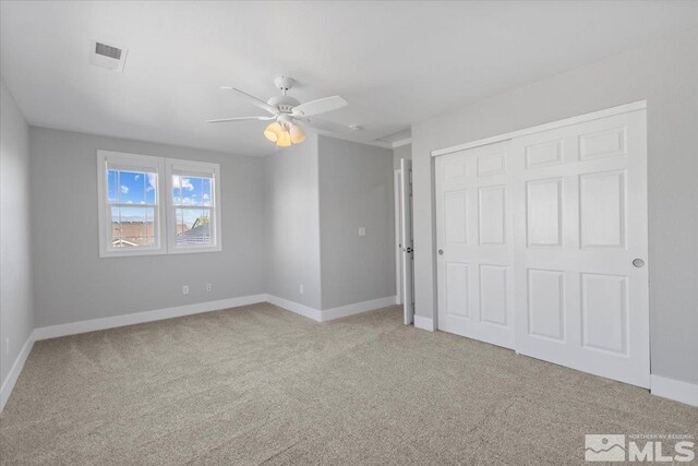 8952 Mahon Dr, Reno, NV 89506 - unfurnished bedroom with carpet flooring, baseboards, a closet, and ceiling fan
