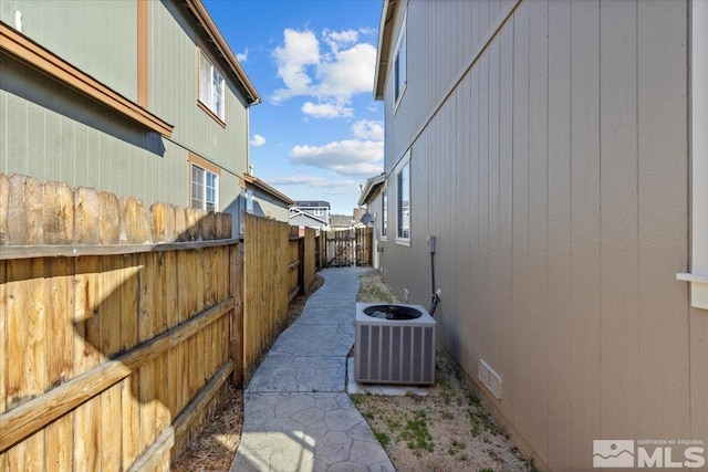 8952 Mahon Dr, Reno, NV 89506 - view of side of home featuring central AC unit and fence