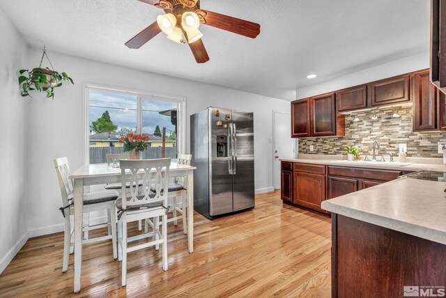 20 E Devere Way, Sparks, NV 89431 - kitchen featuring stainless steel fridge with ice dispenser, a sink, light wood-type flooring, tasteful backsplash, and a ceiling fan