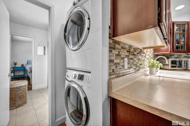 20 E Devere Way, Sparks, NV 89431 - clothes washing area featuring stacked washer / drying machine and light tile patterned floors