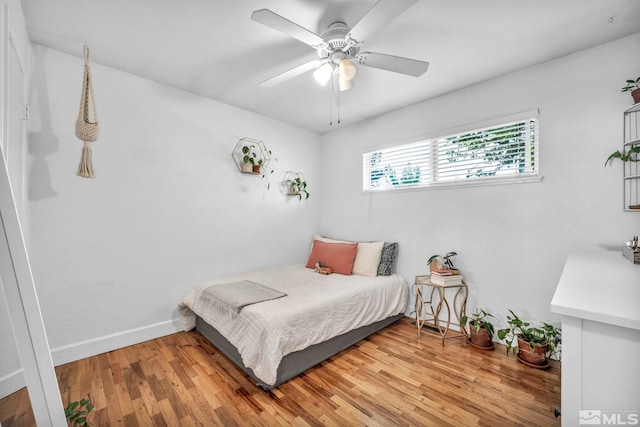 20 E Devere Way, Sparks, NV 89431 - bedroom with light wood-type flooring, a ceiling fan, and baseboards