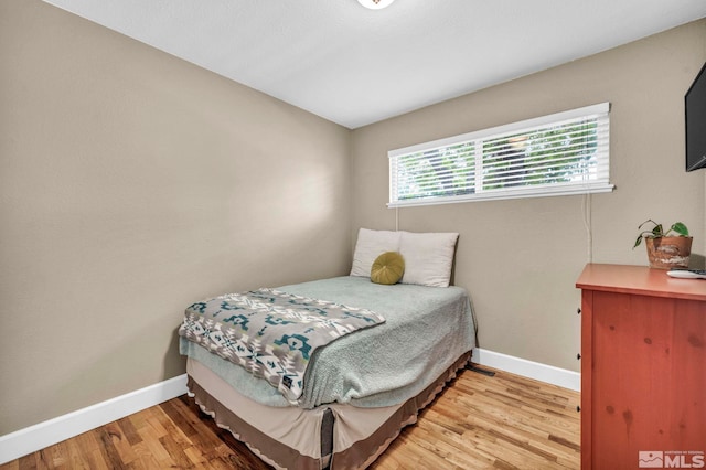 20 E Devere Way, Sparks, NV 89431 - bedroom featuring baseboards and light wood-style floors