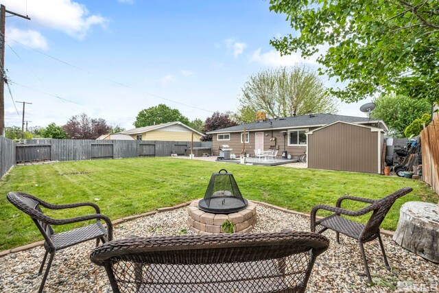 20 E Devere Way, Sparks, NV 89431 - view of yard with a patio area, an outdoor fire pit, a shed, and an outdoor structure