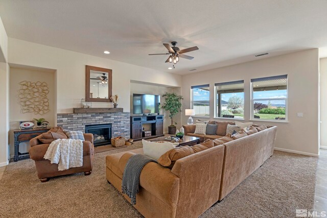 living area with a ceiling fan, baseboards, a fireplace, carpet flooring, and recessed lighting