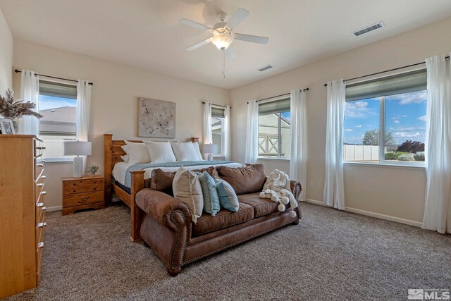 carpeted bedroom with baseboards and ceiling fan