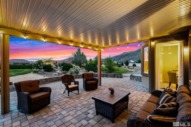 view of patio with a mountain view and outdoor lounge area