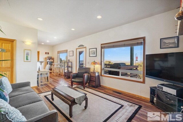 2045 Flint Rd, Reno, NV 89521 - living area with wood finished floors, plenty of natural light, and recessed lighting