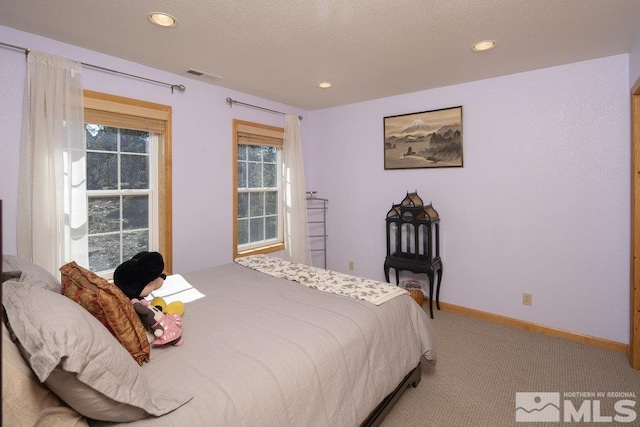 bedroom with carpet floors, recessed lighting, and baseboards