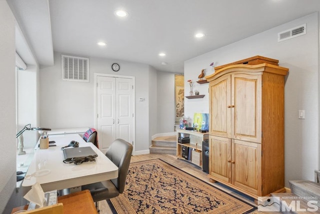 office space with recessed lighting, baseboards, and light wood-style flooring