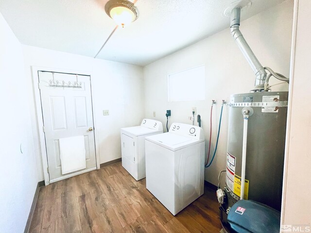 220 Pamela Dr, Walker Lake, NV 89415 - washroom featuring water heater, washer and clothes dryer, and wood finished floors