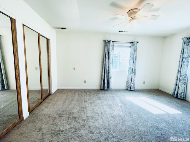 220 Pamela Dr, Walker Lake, NV 89415 - unfurnished bedroom featuring multiple closets, carpet, baseboards, and a ceiling fan