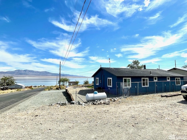 220 Pamela Dr, Walker Lake, NV 89415 - view of home's exterior with fence and a water and mountain view
