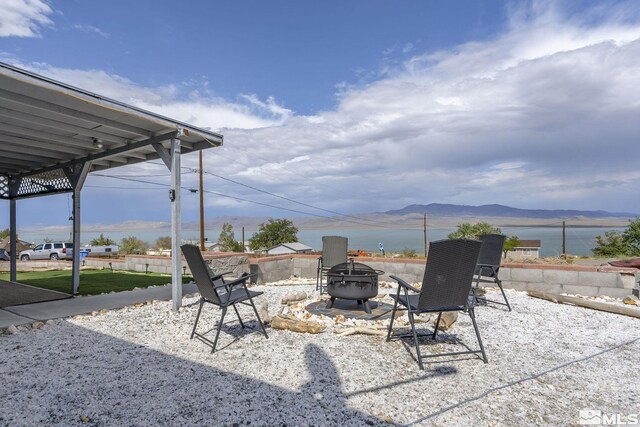 220 Pamela Dr, Walker Lake, NV 89415 - view of patio with an outdoor fire pit and a mountain view