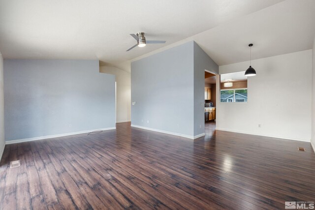 123 River Village Cir, Dayton, NV 89403 - unfurnished living room with dark wood-type flooring, ceiling fan, baseboards, and vaulted ceiling