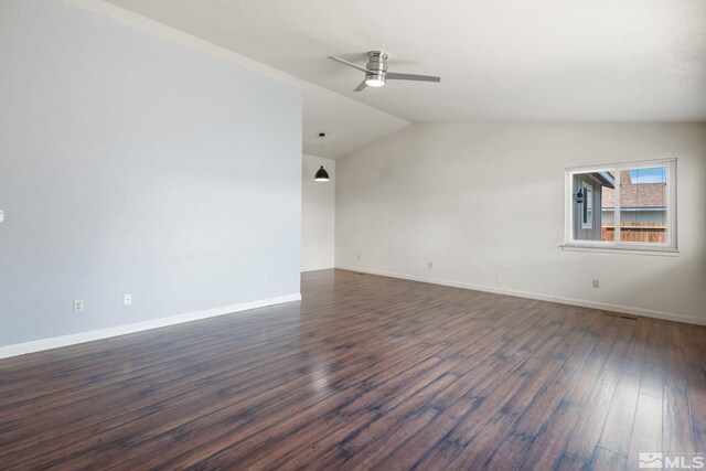 123 River Village Cir, Dayton, NV 89403 - empty room with vaulted ceiling, dark wood-type flooring, a ceiling fan, and baseboards