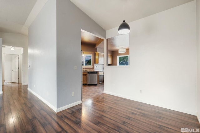 123 River Village Cir, Dayton, NV 89403 - unfurnished dining area with lofted ceiling, dark wood-style flooring, and baseboards