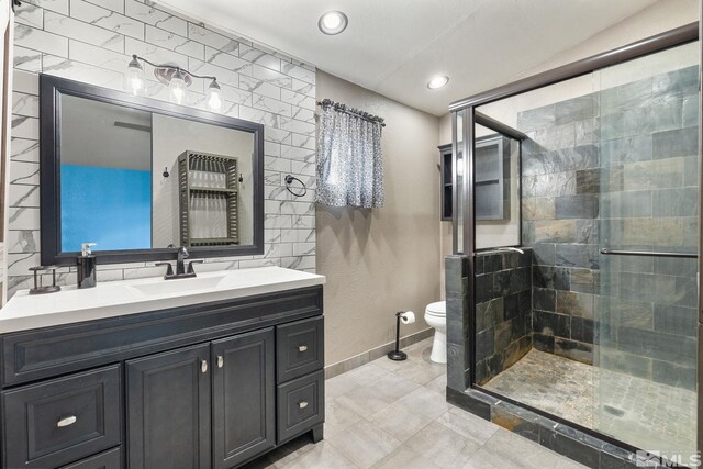 123 River Village Cir, Dayton, NV 89403 - full bath with toilet, a stall shower, baseboards, vanity, and recessed lighting