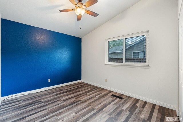 123 River Village Cir, Dayton, NV 89403 - empty room with vaulted ceiling, wood finished floors, baseboards, and a ceiling fan