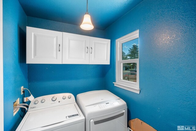 123 River Village Cir, Dayton, NV 89403 - washroom featuring cabinet space, washing machine and clothes dryer, and a textured wall