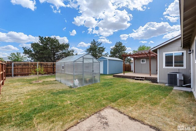 123 River Village Cir, Dayton, NV 89403 - view of yard with an outdoor structure, a deck, central AC unit, a pergola, and a shed