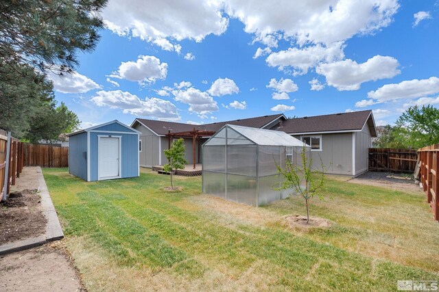 123 River Village Cir, Dayton, NV 89403 - view of yard with a greenhouse, an outdoor structure, and a storage unit