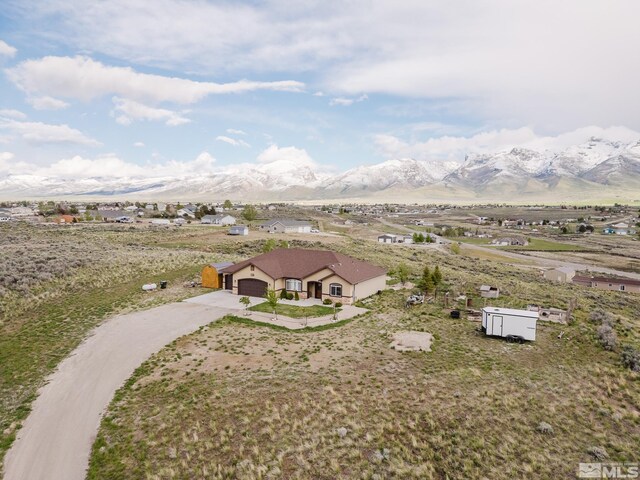 748 Thistle Dr, Spring Creek, NV 89815 - aerial view of property and surrounding area featuring a mountain backdrop