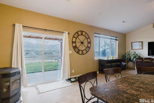 748 Thistle Dr, Spring Creek, NV 89815 - dining space with light tile patterned floors and lofted ceiling