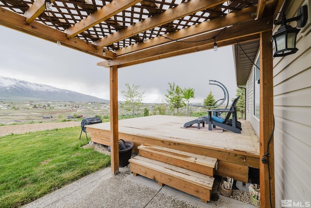 748 Thistle Dr, Spring Creek, NV 89815 - wooden terrace with a mountain view, a yard, and a pergola
