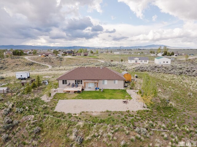 748 Thistle Dr, Spring Creek, NV 89815 - aerial view of sparsely populated area with a mountainous background