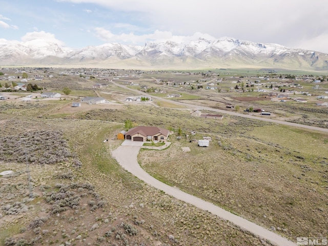 748 Thistle Dr, Spring Creek, NV 89815 - aerial view of property and surrounding area featuring mountains and rural landscape