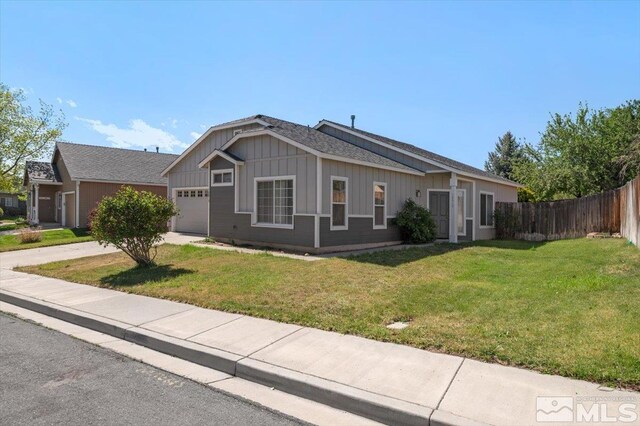 10010 Purple Sage Dr, Reno, NV 89506 - ranch-style house with an attached garage, board and batten siding, and concrete driveway