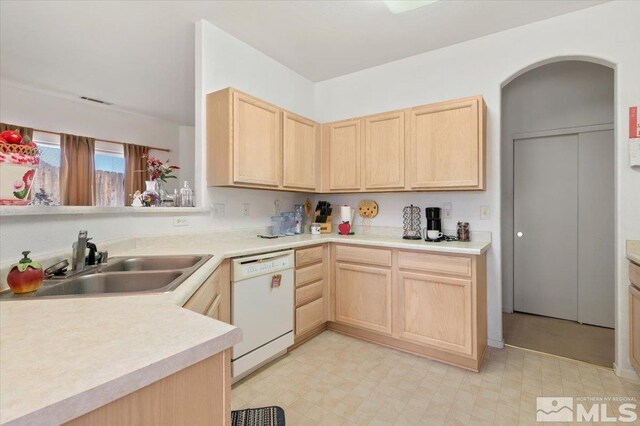 10010 Purple Sage Dr, Reno, NV 89506 - kitchen with light brown cabinets, dishwasher, a sink, light floors, and light countertops